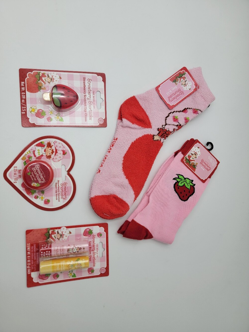 The World of Strawberry Shortcake Lip Balm Lip Gloss Lip Scrub Socks Bundle Set